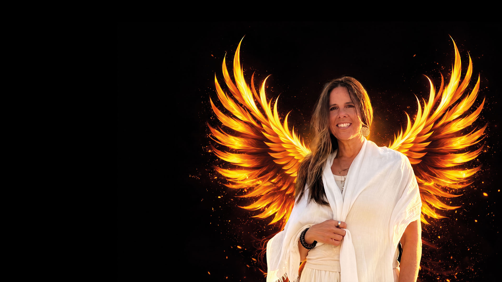 Jodi, smiling, with fiery phoenix wings rising behind her
